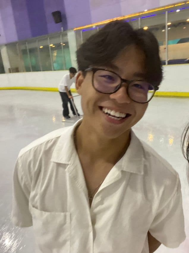 Jesse Chen smiling at an ice rink